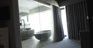 Glass sliding doors from master bed to ensuite