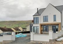 Boundary walls completed, zinc cladding to be added to front porch 